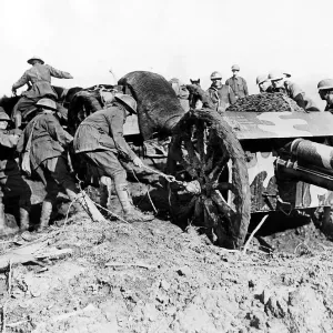 Austraian soldiers drag their gun through the mud of a French field. December 1917 Austraian soldiers drag their gun through the mud of a French field. December 1917