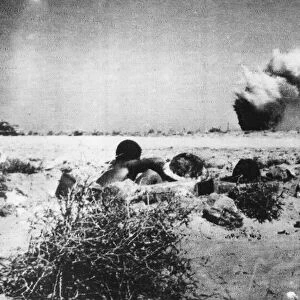 Australian troops dig in to foxholes around El Alamein. 17th July 1942