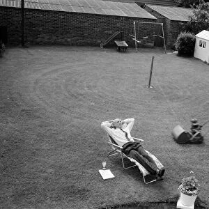 Automatic grass cutting. BOAC pilot Pat Alley demonstrating his mowing method in his