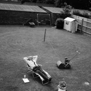 Automatic grass cutting. BOAC pilot Pat Alley demonstrating his mowing method in his Automatic grass cutting. BOAC pilot Pat Alley demonstrating his mowing method in his