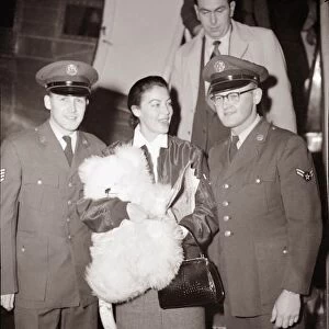 Ava Gardner arriving at London Airport talking to a pilot December 1954