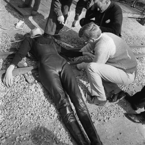 Print of The Avengers featuring Diana Rigg tied to a railway line