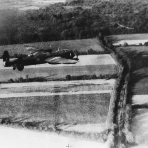 A Avro Lancaster B Mk I of No. 5 Group, flying at low-level over the French countryside A Avro Lancaster B Mk I of No. 5 Group, flying at low-level over the French countryside