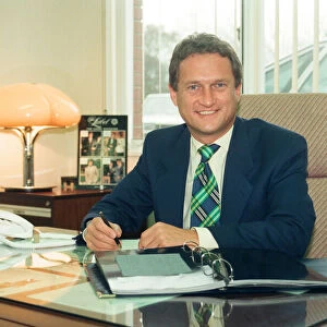 Baird Menswear, Guisborough. Mike Baker, sales director, at his desk. 13th December 1994