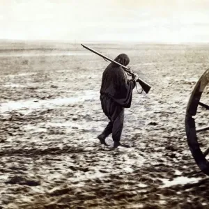 Balkan war 1912 A Turkish refugee walking on the mire of the high road to Balkan war 1912 A Turkish refugee walking on the mire of the high road to