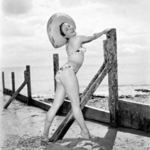 Ballerina Anne Youngman modelling beachwear fashions. 1960 E466-010