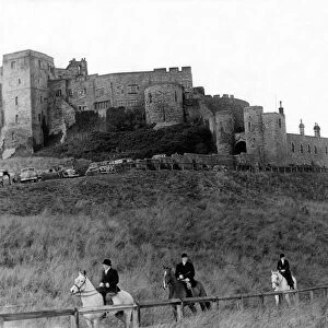 Bamburgh Castle made an impressive background as followers of the Percy Foxhounds moved