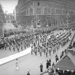 The Band and Corps of Drums of the Welsh and Irish Guards march down Northumberland