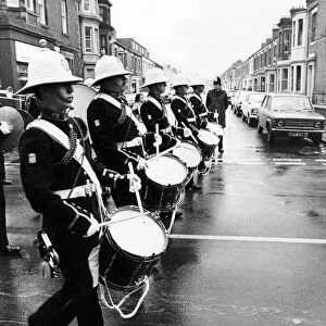 The band of the Royal Marines leading the parade through a deluge to Blyth Market Square