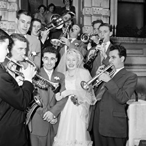 Bandleader Roy Kenton, 25, marries 18-year-old singer of the band Jean Barry at St