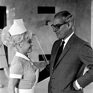 Barbara Windsor and producer Peter Rogers on the film set of Carry On Doctor