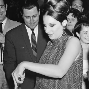 Black and white print of Barbra Streisand at a West End party