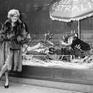Barry Humphries as Dame Edna Everage outside the shop window at Selfridges