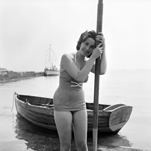 Bathing Girl: Glamour on the Clacton Beach: Who will go rowing with Christine Reynolds