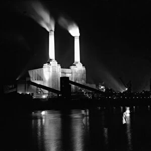 Battersea power station in London, illuminated at night at the time of