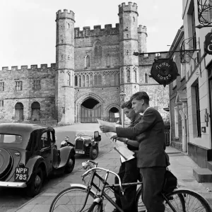 Battle Abbey, Sussex. Boys on bicycles plan the next part of their route outside the main Battle Abbey, Sussex. Boys on bicycles plan the next part of their route outside the main
