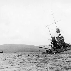 The battleship SMS Bayern of the German Imperial Fleet seen here sinking by the stern
