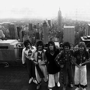 Bay City Rollers standing on top of the RCA building in New York during their first tour