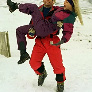 Baywatch stars Gena Lee Nolin being carried by actor David Chokachi while visiting
