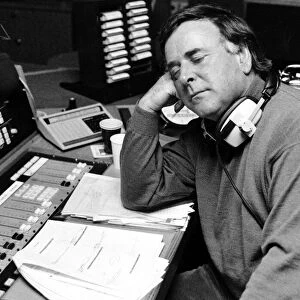 BBC radio disc jockey Terry Wogan asleep at his desk as he returns to BBC Radio Two after