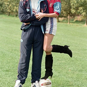 BBC Radio WM presenter Julie Mayer in an Aston Villa kit with Villa midfielder Mark