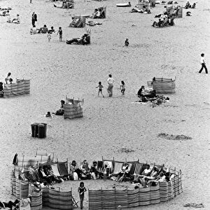 Beach scenes in Ramsgate. Holidaymakers in a "village circle"