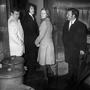 Beatle Paul, McCartney and his fiancee Linda Eastman arrives at a side door of
