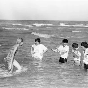 The Beatles in America, 18th February 1964. Having some fun on beach in Miami