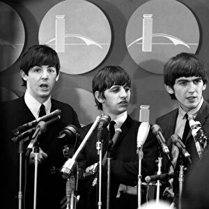 The Beatles answer questions for newsmen and journalists in New York after their arrival