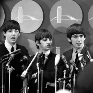 The Beatles answer questions for newsmen and journalists in New York after their arrival