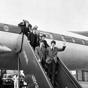 The Beatles arrive in Liverpool for the premier of "A Hard Days Night"