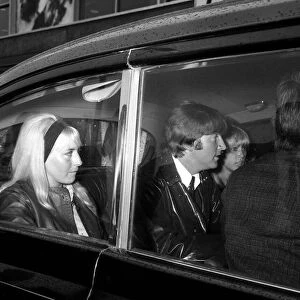 Two of The Beatles arrive at back at London Airport, from their holidays George Harrison