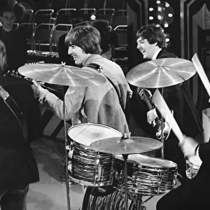 The Beatles... drummer Ringo smokes and Paul and George (centre