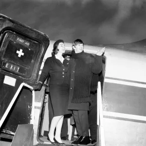 Beatles drummer Ringo Starr with air stewardess as he boards a plane Beatles drummer Ringo Starr with air stewardess as he boards a plane