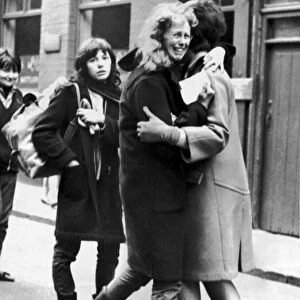 Beatles Fans, two girls hug each other, and one weeps with joy