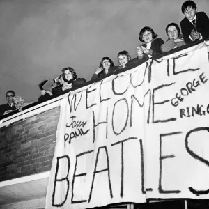 Beatles fans at London Heathrow Airport look forward to welcoming home The Beatles