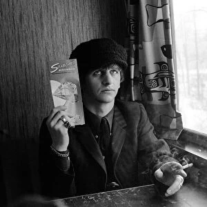 The Beatles February 1964 Ringo Starr holding Seaboard railroad card on the train