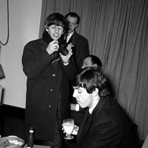 The Beatles Leaving for New York, Ringo Starr taking pictures of Paul McCartney