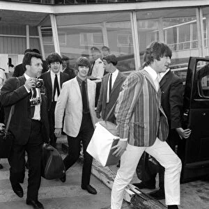 The Beatles at London Airport after returning home from performing in Stockholm, Sweden