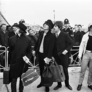 The Beatles at London Heathrow Airport. The Beatles returned home after a