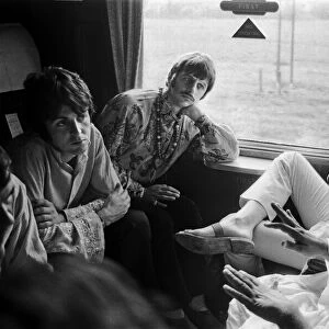 The Beatles with Marhirishi Yogi aboard a train bound for Bangor in North Wales