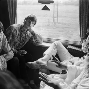 The Beatles with Marhirishi Yogi aboard a train bound for Bangor in North Wales The Beatles with Marhirishi Yogi aboard a train bound for Bangor in North Wales