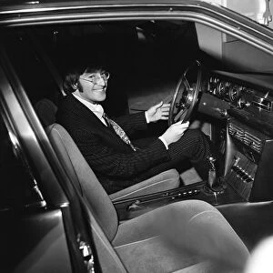 Beatles member John Lennon sits at the wheel of the new Iso Rivolta S4 at the London