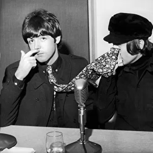 The Beatles Paul McCartney and John Lennon pictured at a backstage news press conference