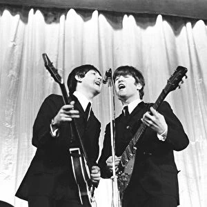 Beatles Paul McCartney and John Lennon seen here performing on stage November 1964 ***