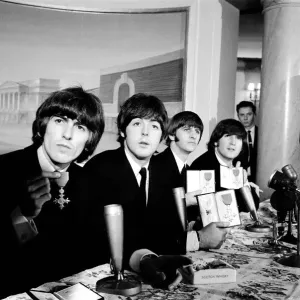 The Beatles pose with their MBEs at a press conference held at the Saville Theatre The Beatles pose with their MBEs at a press conference held at the Saville Theatre