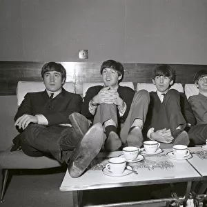 The Beatles relax in their dressing room between the rehearsals for the Royal Variety