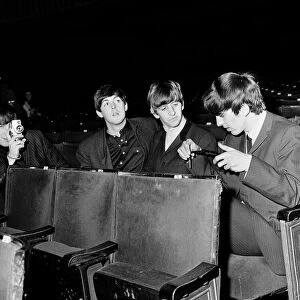The Beatles at the Ritz Cinema in Belfast. John Lennon taking pictures in Belfast