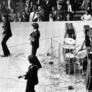 The Beatles on stage at the Palais des Sport in Paris. June 1965