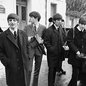 The Beatles walk about in Paris, France during their tour 15 January 1964